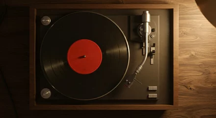 Papier peint photo Good music listening records, old memories, vinyl images, Top-down view of a vintage vinyl record player with a spinning disc