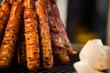 skewers of golden and tempting grilled sausages are neatly arranged