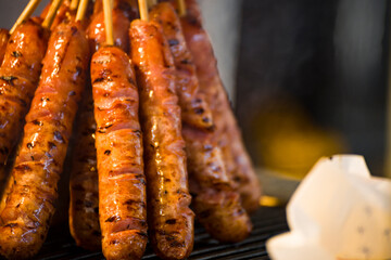skewers of golden and tempting grilled sausages are neatly arranged