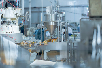 Industrial food production line with a worker ensuring process accuracy and safety Focus on...