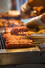 skewers of golden and tempting grilled sausages are neatly arranged