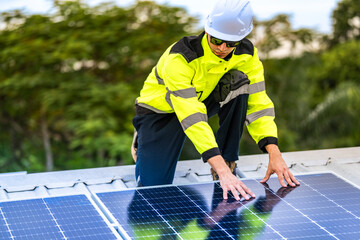 A skilled technician adjusts a solar panel on rooftop, emphasizing the transition to sustainable energy. Equipped with safety gear, the worker demonstrates precision in renewable energy installations.