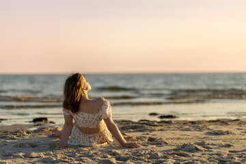 Relaxation at sunset on a tranquil beach with gentle waves and soft sand