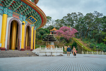 A couple visiting the Wuji Tianyuan Temple, A Majestic Marvel of Taiwan’s Spiritual and Architectural Beauty