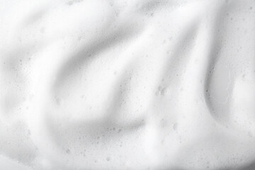 White fluffy foam as background, top view