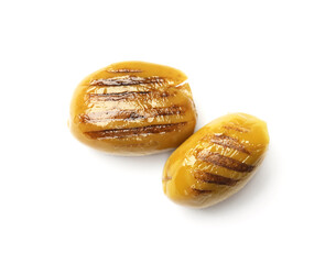 Two grilled green olives on white background, top view