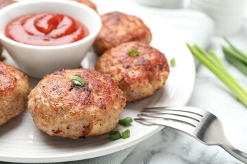 Delicious patties served on white marble table, closeup