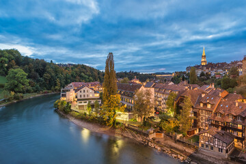 Bern (Berne) Switzerland night city skyline at old town and Aare River in autumn season