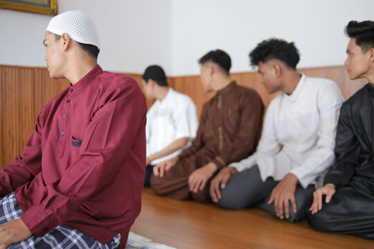 Muslim Prayer Sitting In A Row And Turn Head To The Right To Finish Salah At The Mosque