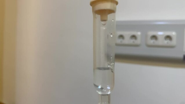 Infusion fluid drips in patient treatment. dripping tube infusion pumping in hospital.