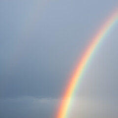 rainbow over the blue sky