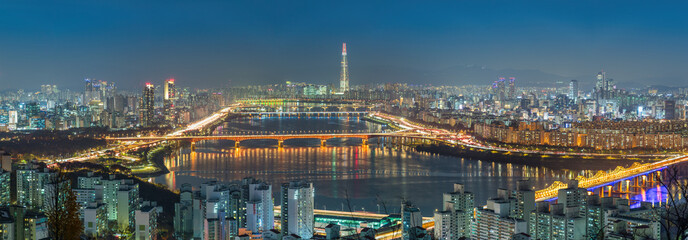 Seoul South Korea panorama city skyline night at Han River view from Maebong Mountain Park in autumn