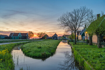 Fototapeta premium Dutch traditional house sunrise at Zaanse Schans Village, Netherlands