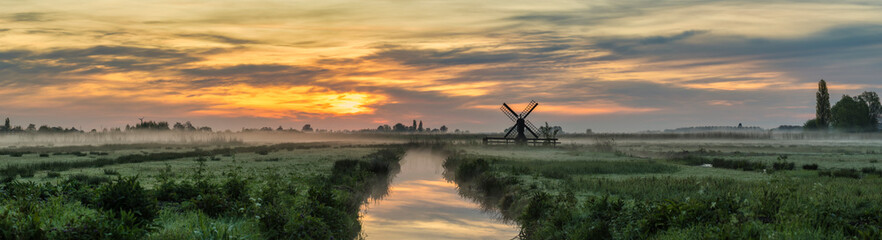 Small Dutch Windmill And Field