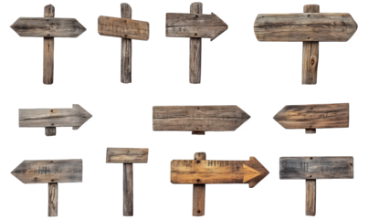 collection of wooden directional signs in various shapes and orientations. each with a rustic appearance these signs are designed to guide or indicate directions. often used in outdoor settings like p