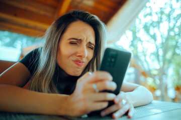 Woman Squinting Trying to See on her Smartphone. Myopic girl having problems reading small texts on...
