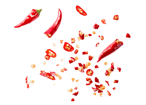Scattered sliced red chili peppers with seeds and chopped pieces on a transparent background, fiery spice ingredient, dynamic food composition for culinary and seasoning designs