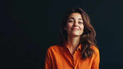 Portrait of a smiling woman in orange shirt
