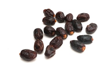dried black dates isolated on white background