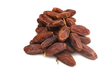 Pile of tasty dry dates isolated on white background.