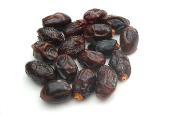 Pile of tasty dry dates isolated on white background.