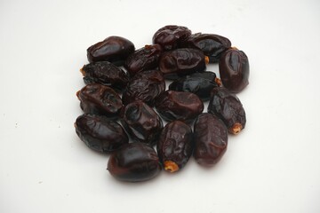 Pile of tasty dry dates isolated on white background.