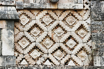 Close up of the Puuc stye frieze with reliefs of Venus on the façade of the west building in the nunnery quadrangle at the Mayan temple complex of Uxmal,Near Merida,Yucatan,Mexico