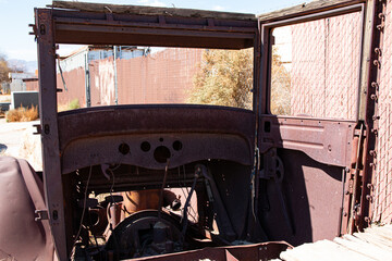 Inside the cab of what remains of an antique Model T flatbed truck.