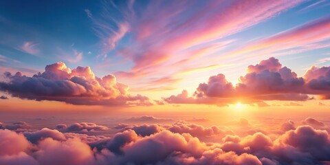 Fototapeta premium Softly glowing pink clouds float across a tranquil sky at sunrise