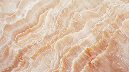 Soft pink and beige textured background resembling rippling marble waves.