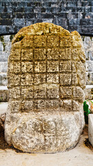 Mayan stela commemorating the ascension of a ruler in front of the North building of the Nunnery...
