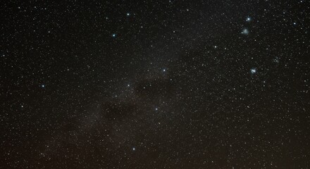 Obraz premium Celestial Tapestry: A breathtaking view of the night sky, with countless stars twinkling against a deep black canvas, the milky way stretches across the vast expanse, inspiring awe and wonder.