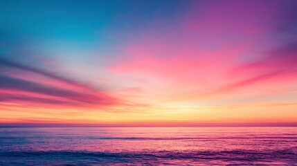 Fototapeta premium Beautiful sunset over the ocean with vibrant colors. A serene and peaceful scene.