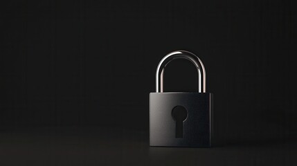 Fototapeta premium A simple black padlock stands alone against a dark background, symbolizing security and protection.