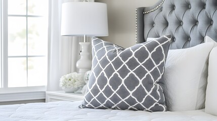 Grey and White Geometric Pillow on Luxurious Bed
