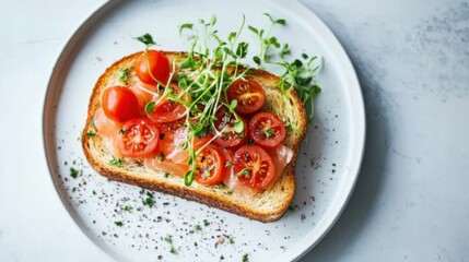Gourmet toast topped with smoked salmon, cherry tomatoes, and microgreens, plated elegantly for breakfast