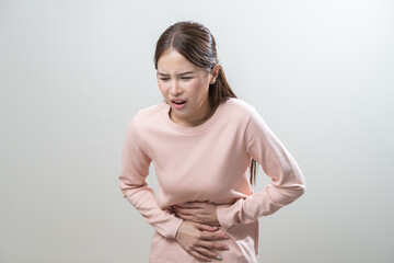 Flatulence asian young woman intolerance hand in stomach ache, suffer from food poisoning,...