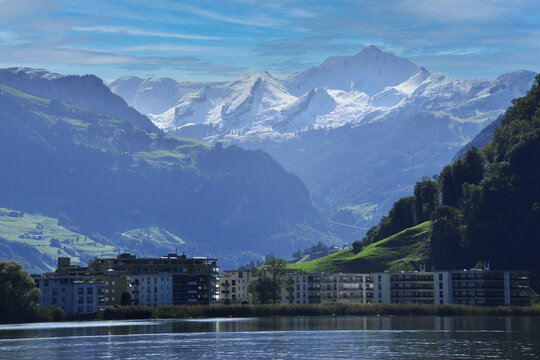 village along Lake Lucerne with Alps in background