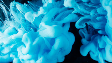 Pigment splash. Fume paint explosion. Blue vapor stream swirl mix on black background. Blur color haze abstract dye drop wave spill.