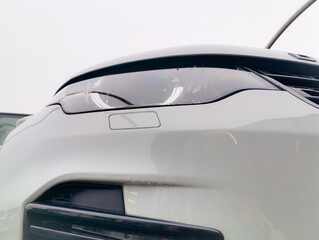 A detailed vision of the automobile. Headlight, mirror, handle