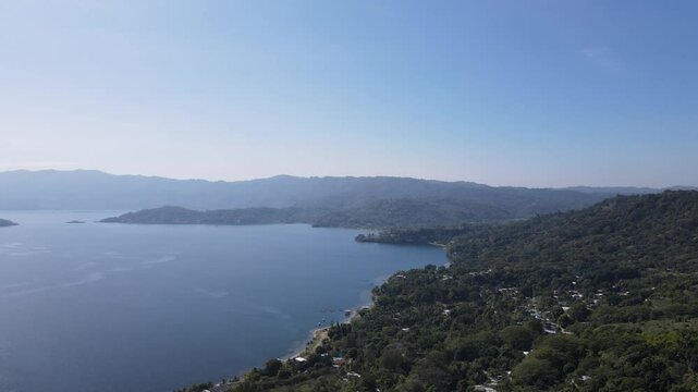 Views of the beautiful Ilopango Lake in El Salvador, with mountains and volcanoes in the background