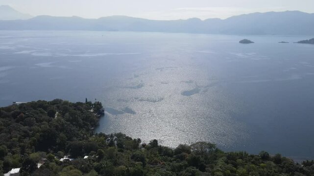 Views of the beautiful Ilopango Lake in El Salvador, with mountains and volcanoes around during the summer