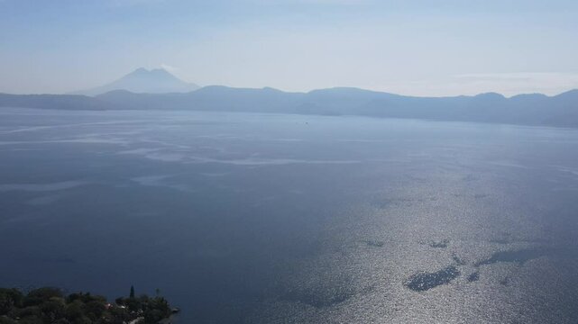 Views of the beautiful Ilopango Lake in El Salvador, with mountains and volcanoes around during the summer