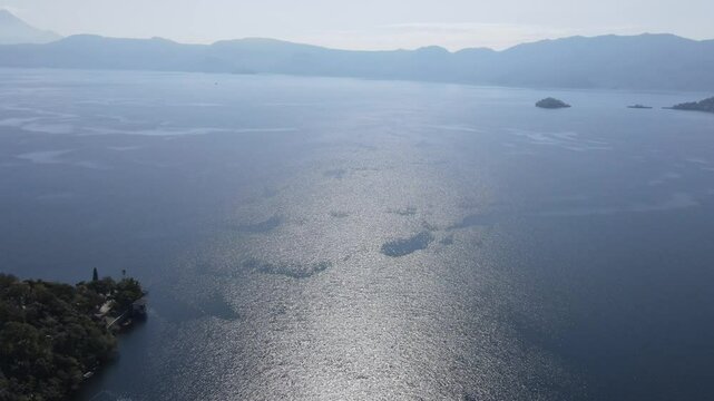 Views of the beautiful Ilopango Lake in El Salvador, with mountains and volcanoes around during the summer