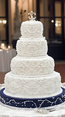 Elegant Four Tiered White Wedding Cake Photo Features Detailed Floral