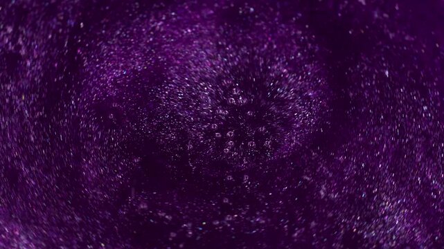 Violet swirl. Spiral paint. Thick dark lilac spiral stream liquid potion mixed with shiny sparkles. Purple caramel boils with bubbles texture.