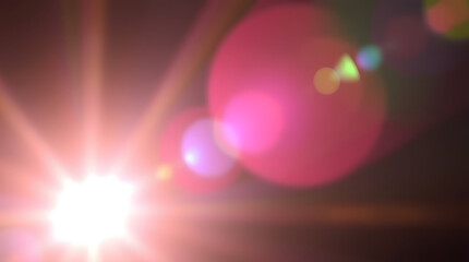 Bright light burst with soft bokeh and lens flare effects on a dark background