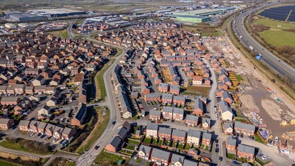Obraz premium Aerial view of suburban neighborhood and highway.