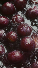 Close-up of Shiny Dark Purple Plums Simmering in a Dark Liquid for Delicious Plum Drink or Compote Preparation