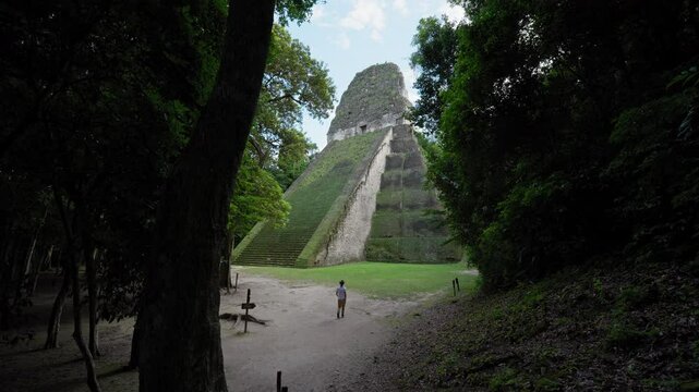 One person walking towards the Temple V in Tikal National Park, Guatemala